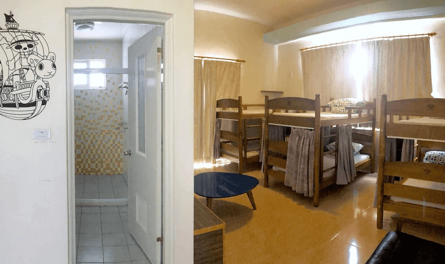 【綠島住宿】火燒島潛水度假中心的木質上下鋪宿舍型房間，窗邊自然採光充足，搭配獨立浴室空間，牆面貼有卡通風格塗鴉，展現活潑氛圍，適合背包客入住。