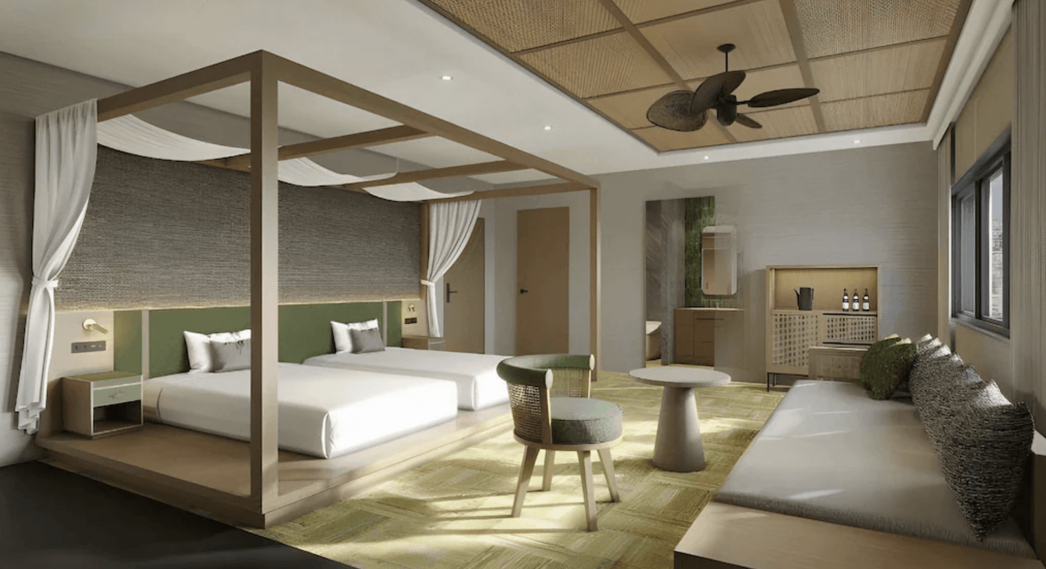 溫泉世界飯店及度假村 (SPAWORLD HOTEL&RESORT) 的客房內部，採用自然質樸的木質與編織元素裝潢。房內設有帶白色紗帳框架的雙人床、造型吊扇、小圓桌與舒適的長型沙發休息區，營造出放鬆的度假氛圍